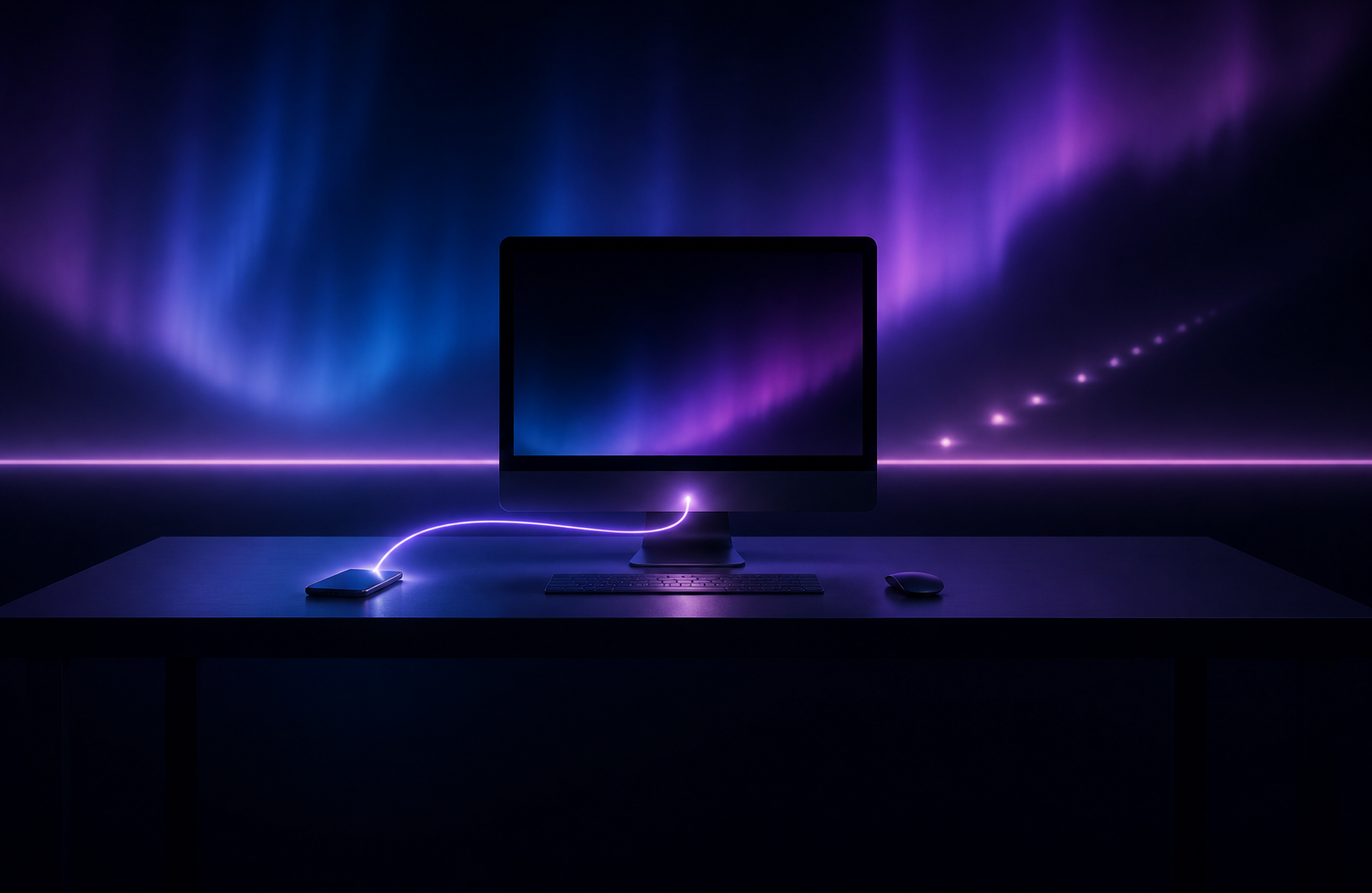 A desktop computer and a phone on one desk in a dark room, linked by a curved light path